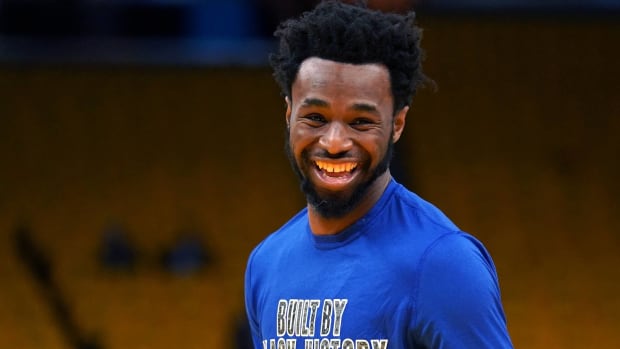 Warriors forward Andrew Wiggins smiles during pre-game warmups.