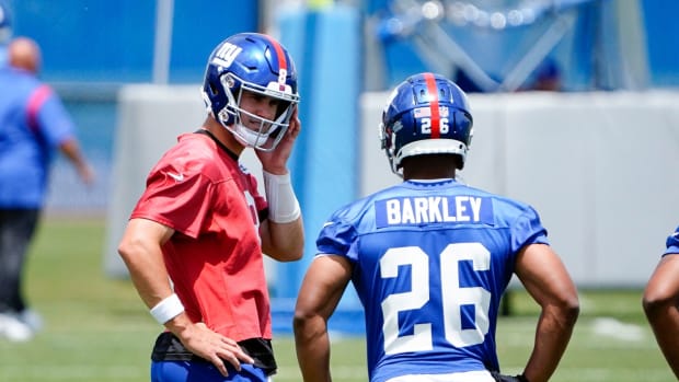 New York Giants quarterback Daniel Jones (8) and running back Saquon Barkley (26) on the field for mandatory minicamp at the Quest Diagnostics Training Center on Tuesday, June 7, 2022, in East Rutherford.