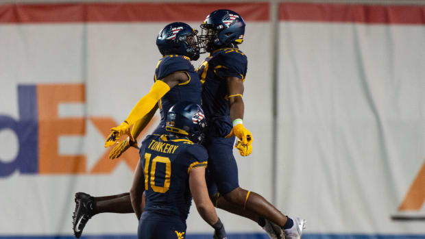 Dec 31, 2020; Memphis, TN, USA; West Virginia Mountaineers players celebrate during the second half against the Army Black Knights at Liberty Bowl Stadium. Mandatory Credit: Justin Ford-USA TODAY Sports