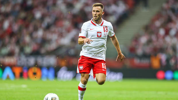 Maciej Rybus pictured playing for Poland against England in 2021