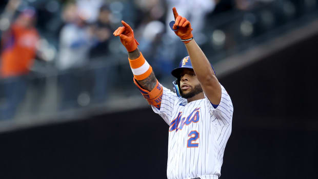 May 3, 2022; New York City, New York, USA; New York Mets first baseman Dominic Smith (2) reacts after hitting a two run double against the Atlanta Braves during the first inning at Citi Field.