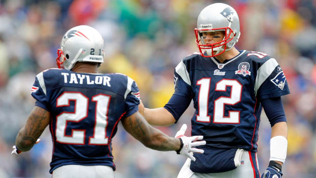 Tom Brady (12) and Fred Taylor (21) while with the Patriots.