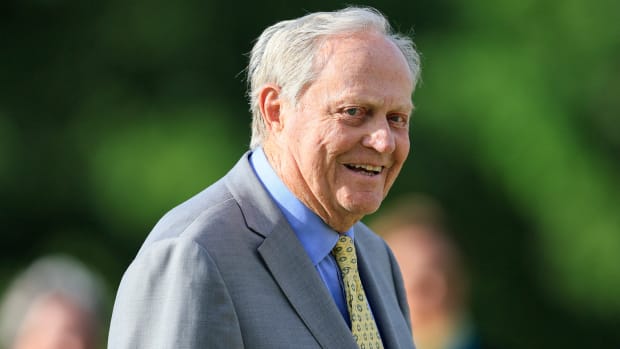 18-time major champion golfer Jack Nicklaus smiles as he stands on the 18th green after the Memorial Tournament.