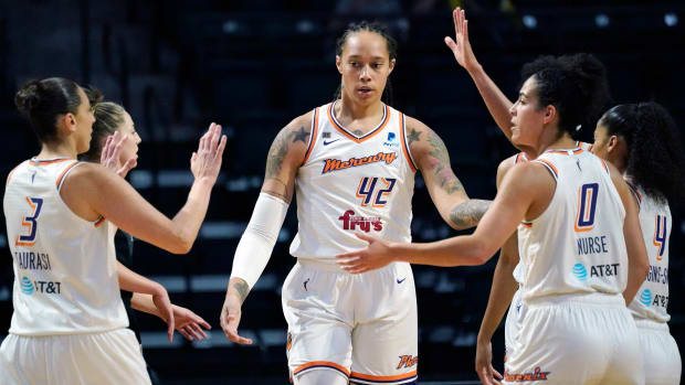 Mercury center Brittney Griner (42) is congratulated on a play against the Storm in the first half of the second round of the WNBA basketball playoffs.