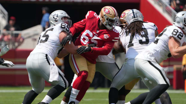 Aug 29, 2021; Santa Clara, California, USA; San Francisco 49ers defensive lineman Darrion Daniels (65) is defended by Las Vegas Raiders center Jimmy Morrissey (65) and offensive tackle Devery Hamilton (73) in the first half at Levi's Stadium.