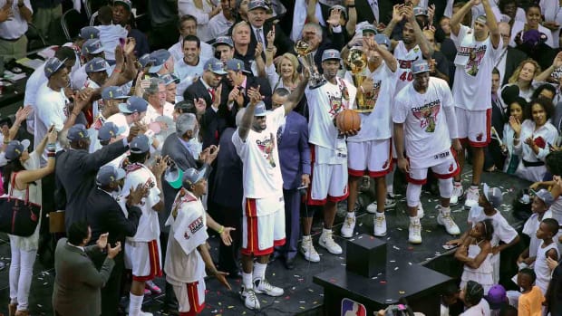 Miami Heat small forward LeBron James (6), power forward and Chris Bosh, and Dwyane Wade celebrates winning the 2012 NBA championship against the Oklahoma City Thunder.