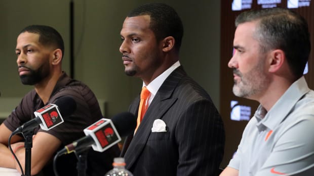 Cleveland Browns quarterback Deshaun Watson, center, along with General Manager Andrew Berry, left, and head coach Kevin Stefanski, right, field questions from reporters during Watson's introductory press conference at the Cleveland Browns Training Facility in Berea.