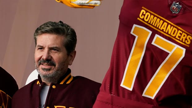 Dan Snyder, co-owner and co-CEO of the Washington Commanders, poses for photos during an event to unveil the NFL football team’s new identity, Wednesday, Feb. 2, 2022, in Landover, Md.