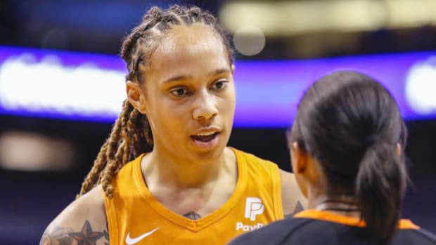 Mercury center Brittney Griner talks with a referee after a no-call during a game against the Aces.