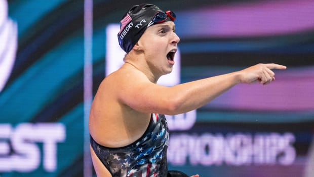 American swimmer Katie Ledecky cheers for her teammates during the 800-meter freestyle relay at the 2022 World Swimming Championships.