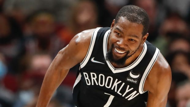 Nets forward Kevin Durant (7) smiles after scoring against the Bulls during the first half at United Center.