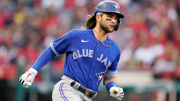 Toronto Blue Jays’ Bo Bichette (11) runs to second base on a ground-rule double during the second inning of a baseball game against the Los Angeles Angels in Anaheim, Calif., Friday, May 27, 2022.