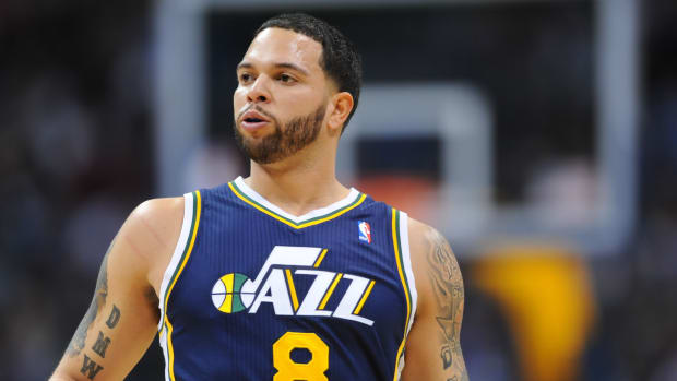 Utah Jazz point guard Deron Williams (8) in the first quarter against the Denver Nuggets at the Pepsi Center.