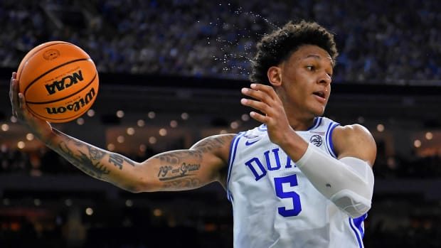 Apr 2, 2022; New Orleans, LA, USA; Sweat flies through the air as Duke Blue Devils forward Paolo Banchero (5) saves a ball from going out of bounds against the North Carolina Tar Heels during the second half during the 2022 NCAA men’s basketball tournament Final Four semifinals at Caesars Superdome.
