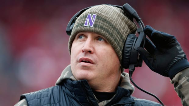 Northwestern Wildcats head coach Pat Fitzgerald looks to the scoreboard.