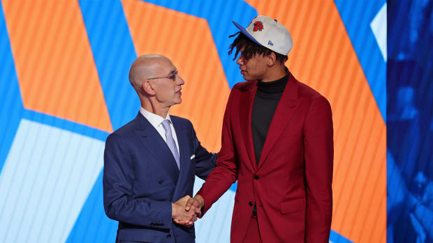 Jun 23, 2022; Brooklyn, NY, USA; Ousmane Dieng (New Zealand Breakers) shakes hands with NBA commissioner Adam Silver after being selected as the number eleven overall pick by the New York Knicks in the first round of the 2022 NBA Draft at Barclays Center.