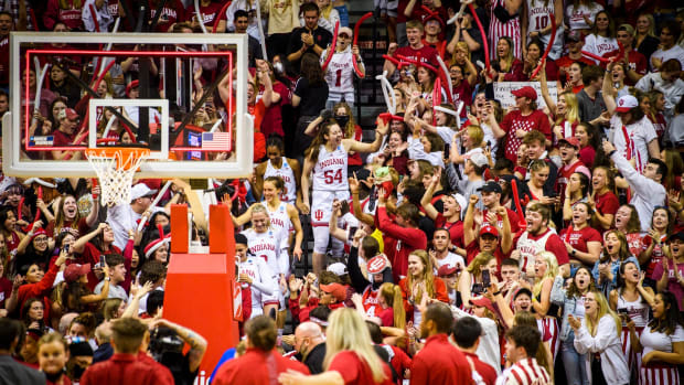The Hoosiers high five their fans in the stands.