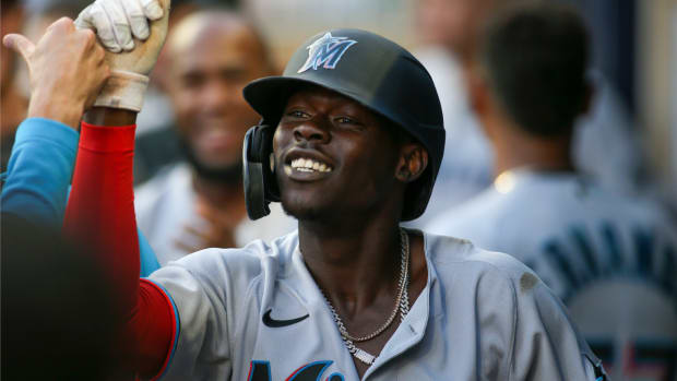 Apr 23, 2022; Atlanta, Georgia, USA; Miami Marlins second baseman Jazz Chisholm Jr. (2) celebrates with teammates after hitting a home run against the Atlanta Braves in the first inning at Truist Park. Mandatory Credit: Brett Davis-USA TODAY Sports