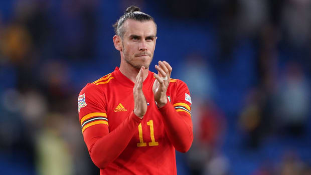 Welsh soccer player Gareth Bale claps during a World Cup qualifying game.