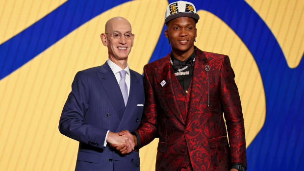 Pacers guard Bennedict Mathurin poses with Adam Silver at the NBA Draft.
