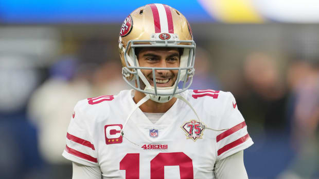 49ers quarterback Jimmy Garoppolo smiles while warming up before the NFC Championship Game.