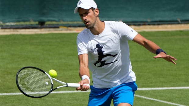 Serbia’s Novak Djokovic plays a return as he practices ahead of the Wimbledon tennis championships in London, Sunday, June 26, 2022. (AP Photo/Alastair Grant)