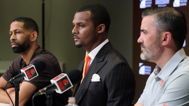 Browns quarterback Deshaun Watson (center) along with General Manager Andrew Berry (left) and head coach Kevin Stefanski (right) field questions from reporters during Watson’s introductory press conference.