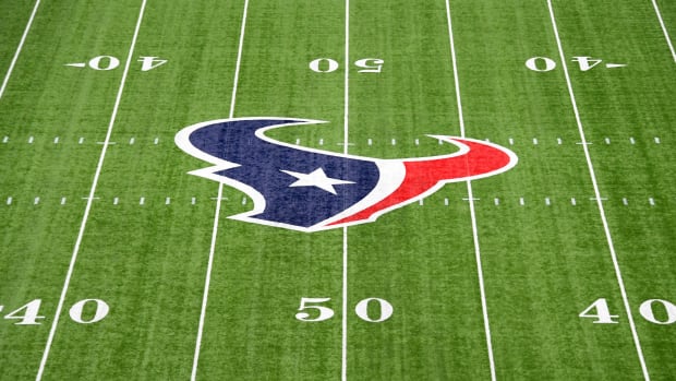 Overhead view of the Houston Texans logo at midfield during a game.