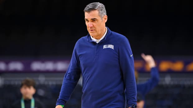 Villanova head coach Jay Wright walks on the court during a practice session before the 2022 NCAA men’s basketball tournament Final Four.