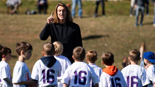 Jaguars quarterback Trevor Lawrence talks with young participants of the Trevor Lawrence Youth Football Camp.