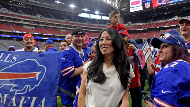 Jan 4, 2020; Houston, Texas, USA; Buffalo Bills owner Kim Pegula poses for pictured with fan before the AFC Wild Card NFL Playoff game against the Houston Texans at NRG Stadium.