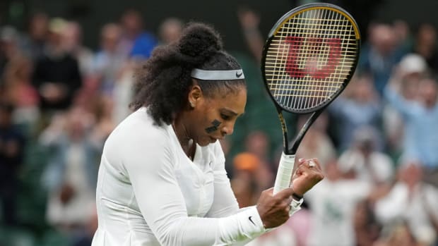 Serena Williams of the US celebrates after winning a point against France's Harmony Tan in the first round of Wimbledon.