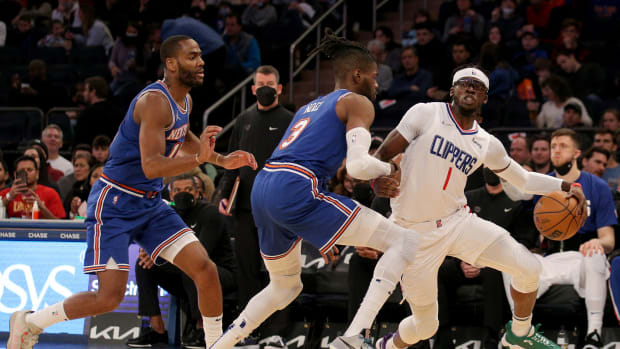 Jan 23, 2022; New York, New York, USA; Los Angeles Clippers guard Reggie Jackson (1) drives around New York Knicks guard Alec Burks (18) and center Nerlens Noel (3) during the third quarter at Madison Square Garden.