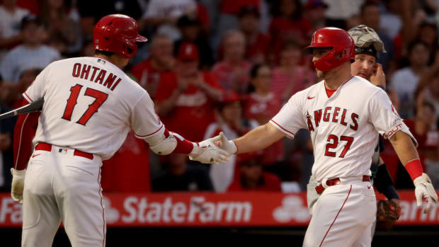 Los Angeles Angels center fielder Mike Trout (27) celebrates with designated hitter Shohei Ohtani (17).