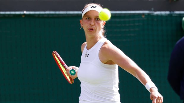 German tennis player Tamara Korpatsch prepares to play a shot during her first round match at Wimbledon.