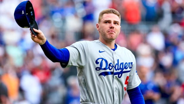 Los Angeles Dodgers first baseman Freddie Freeman walks to the field for the presentation of his World Series championship ring, before the team’s baseball game against the Atlanta Braves on Friday, June 24, 2022 in Atlanta.