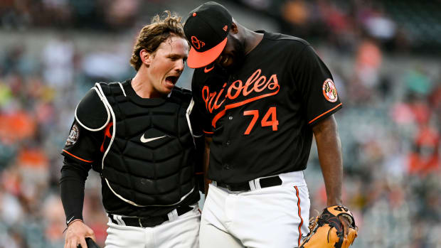 Jun 17, 2022; Baltimore, Maryland, USA;  Baltimore Orioles designated hitter Adley Rutschman (35)] celebrates with relief pitcher Felix Bautista (74) during the seventh inning against the Tampa Bay Rays at Oriole Park at Camden Yards.