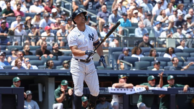 New York Yankees DH Giancarlo Stanton watches home run
