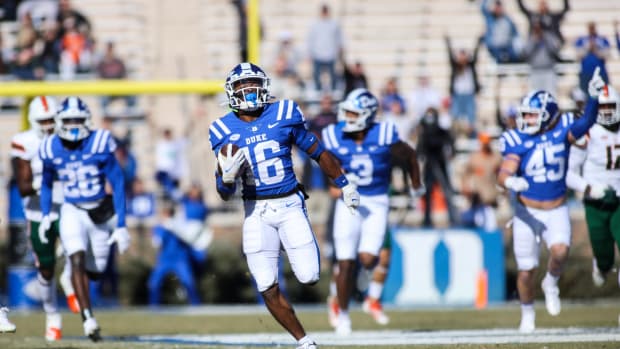 Nov 27, 2021; Durham, North Carolina, USA; Duke Blue Devils quarterback Gavin Spurrier (16) runs with the ball to for a touchdown during the first half of the game against the Miami Hurricanes at Wallace Wade Stadium.