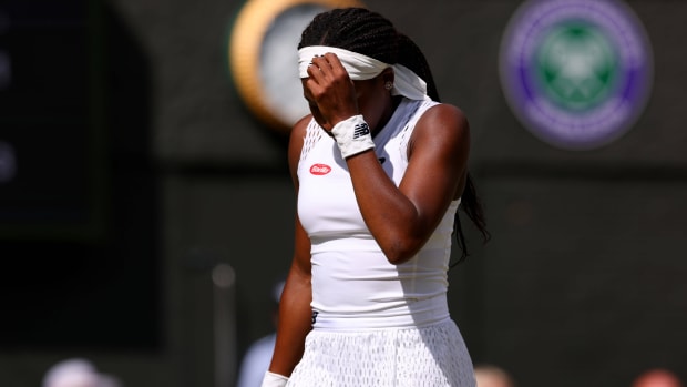 American tennis player Coco Gauff looks down after a point in her third round match at Wimbledon.