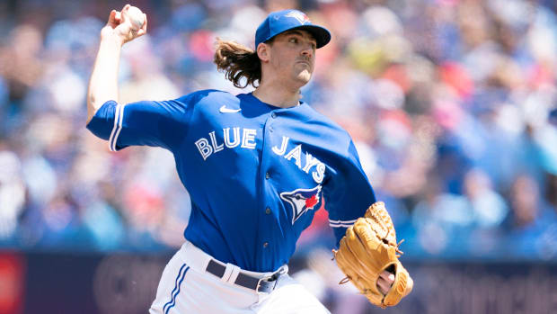 Blue Jays starting pitcher Kevin Gausman (34) throws a pitch during the first inning of a game against the Rays.