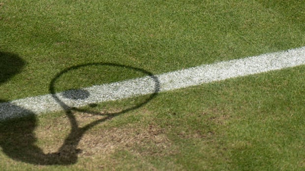 Jun 28, 2022; London, United Kingdom; Shadow of a ball on a racket during the Nick Kyrgios (AUS) and Paul Gubb (GBR) first round match on day two at All England Lawn Tennis and Croquet Club.