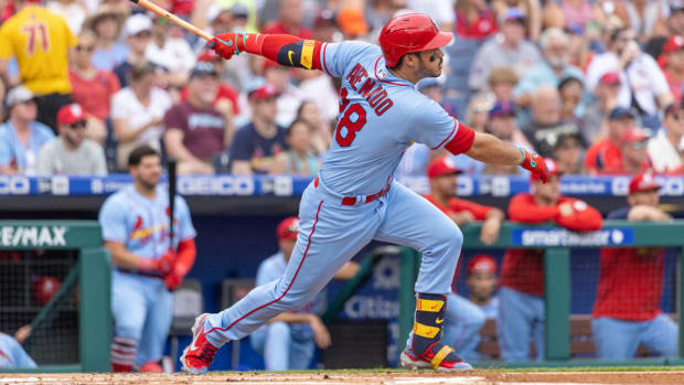 St. Louis Cardinals’ Nolan Arenado (28) follows through on a two run home run during the first inning of a baseball game against the Philadelphia Phillies, Saturday, July 2, 2022, in Philadelphia. (AP Photo/Laurence Kesterson)