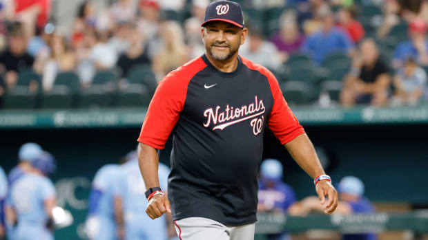 Washington Nationals manager Dave Martinez walks toward the dugout after making a pitching change during the seventh inning of a baseball game against the Texas Rangers Sunday, June 26, 2022, in Arlington, Texas. (AP Photo/Michael Ainsworth)