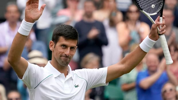 Novak Djokovic thanks the crowd at Wimbledon.