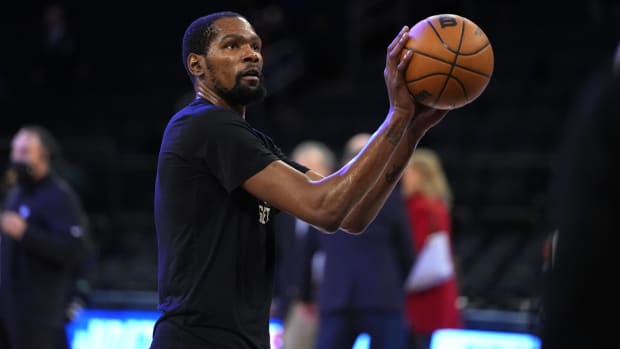 Nets forward Kevin Durant shoots a free throw during pregame warmups.