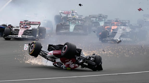 Alfa Romeo driver Guanyu Zhou of China crashes at the start of the British Formula One Grand Prix at the Silverstone circuit, in Silverstone, England, Sunday, July 3, 2022. (AP Photo/Frank Augstein)