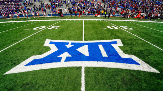 A general view of the Big 12 Conference logo on the field after the game between the Kansas Jayhawks and the Oklahoma Sooners at David Booth Kansas Memorial Stadium.