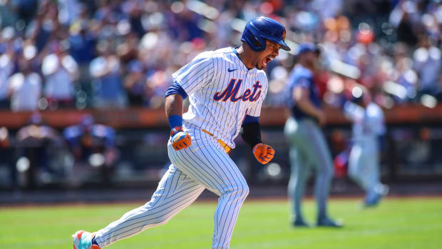 Jul 3, 2022; New York City, New York, USA; New York Mets third baseman Eduardo Escobar (10) reacts after hitting a two-run home run in the fourth inning against the Texas Rangers at Citi Field.