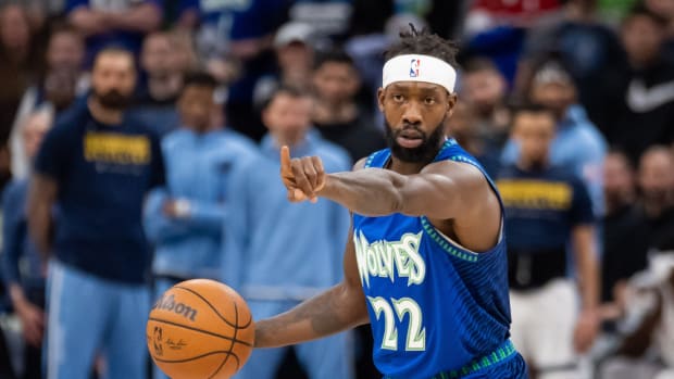 Minnesota Timberwolves guard Patrick Beverley (22) signals his team against the Memphis Grizzlies in the third quarter during game one of the three round for the 2022 NBA playoffs at Target Center.
